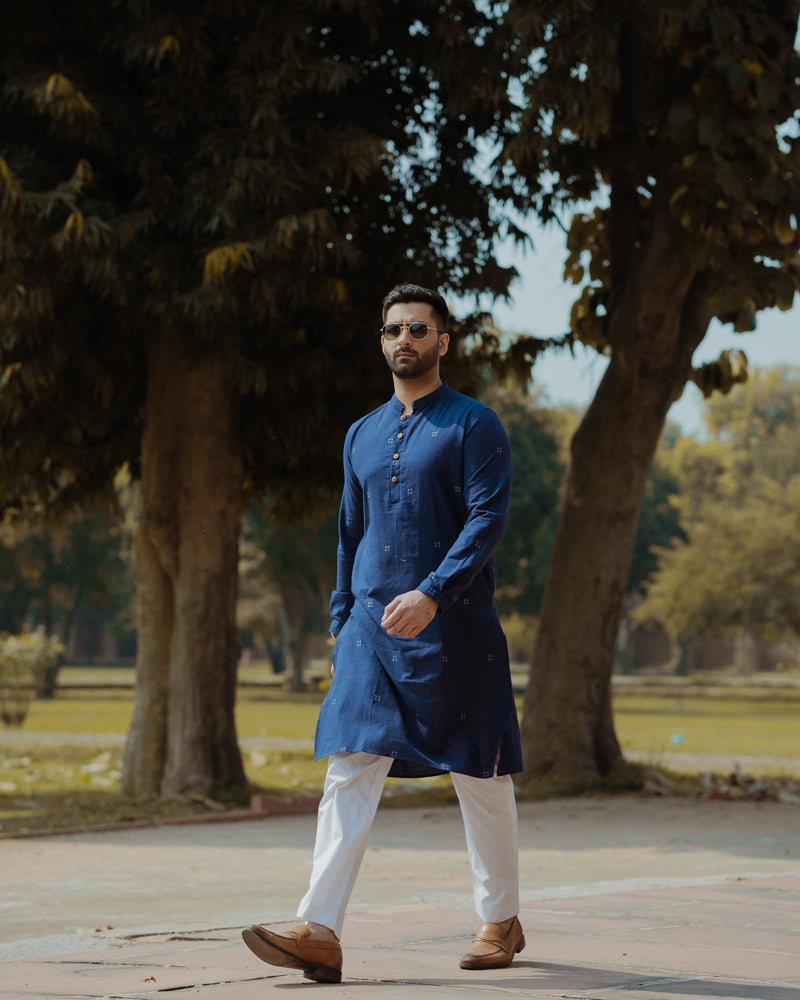 A Good Looking Indian Young Guy Posing with Sitting on Chair with Wearing  Kurta, Pajama, Nehru Coat and Sunglasses Stock Image - Image of good,  looking: 230505789